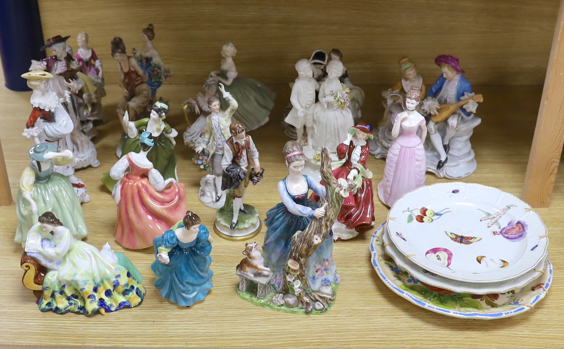 A collection of various porcelain figures including Coalport, Doulton etc. and two dessert plates